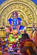 A pandit chanting mantras during a wedding ceremony.