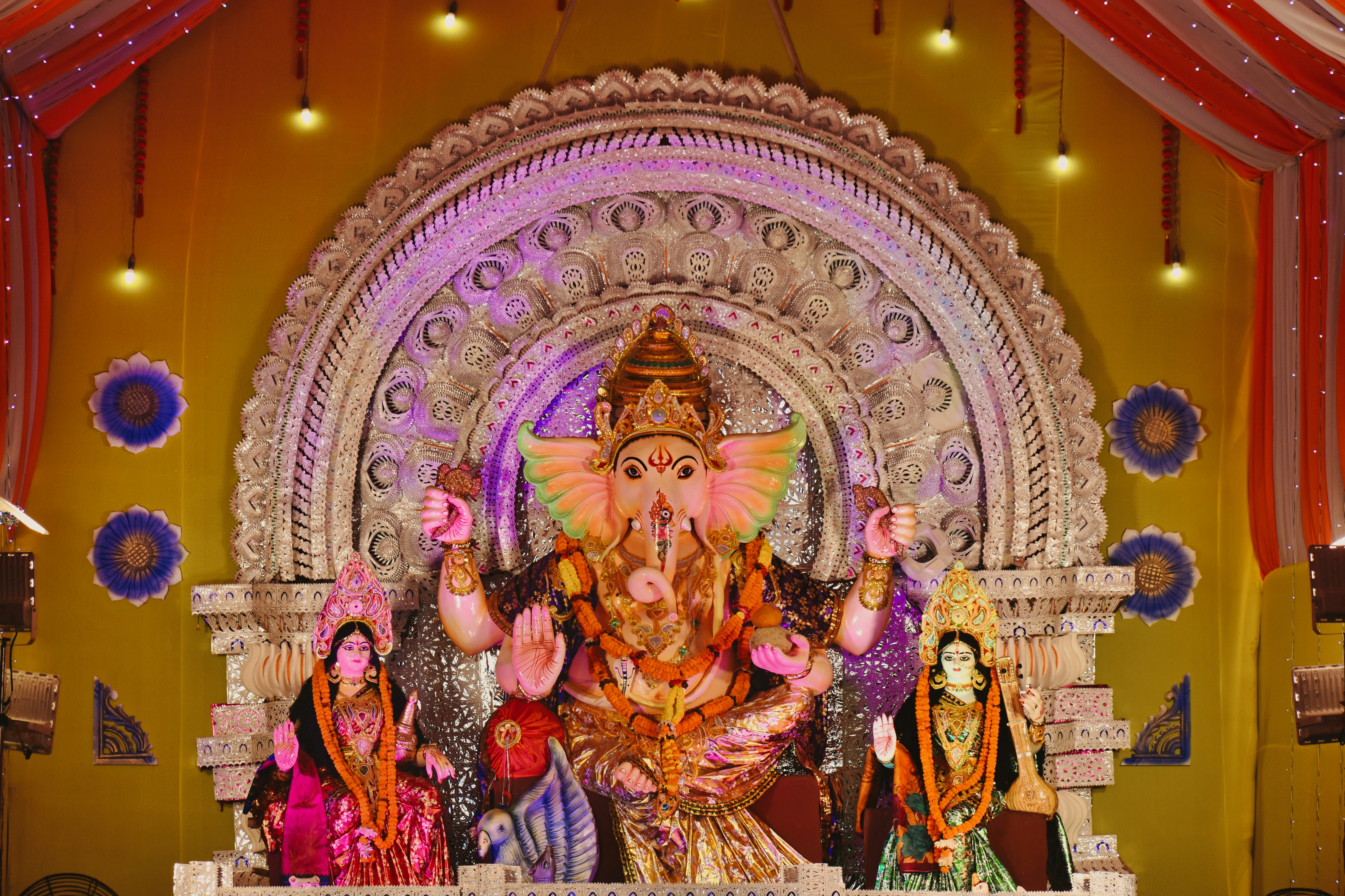 a statue of an elephant with a group of people around it