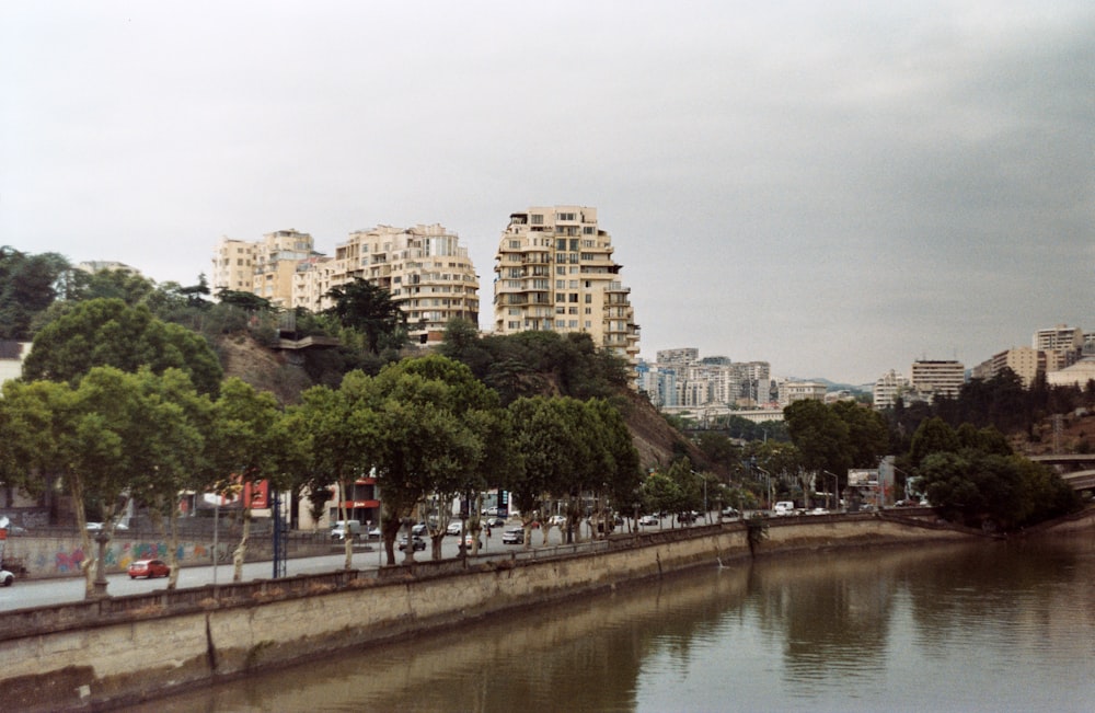 a body of water surrounded by tall buildings