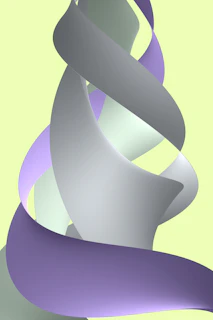 Soft pastel-colored ribbons tied in delicate bows on a light fabric background.