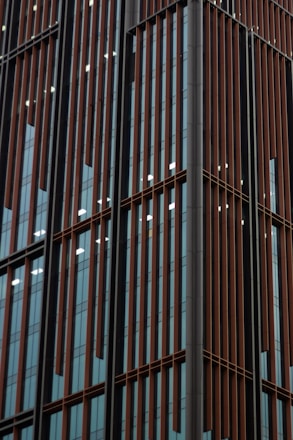Modern aluminum window installation on a sleek commercial building facade.