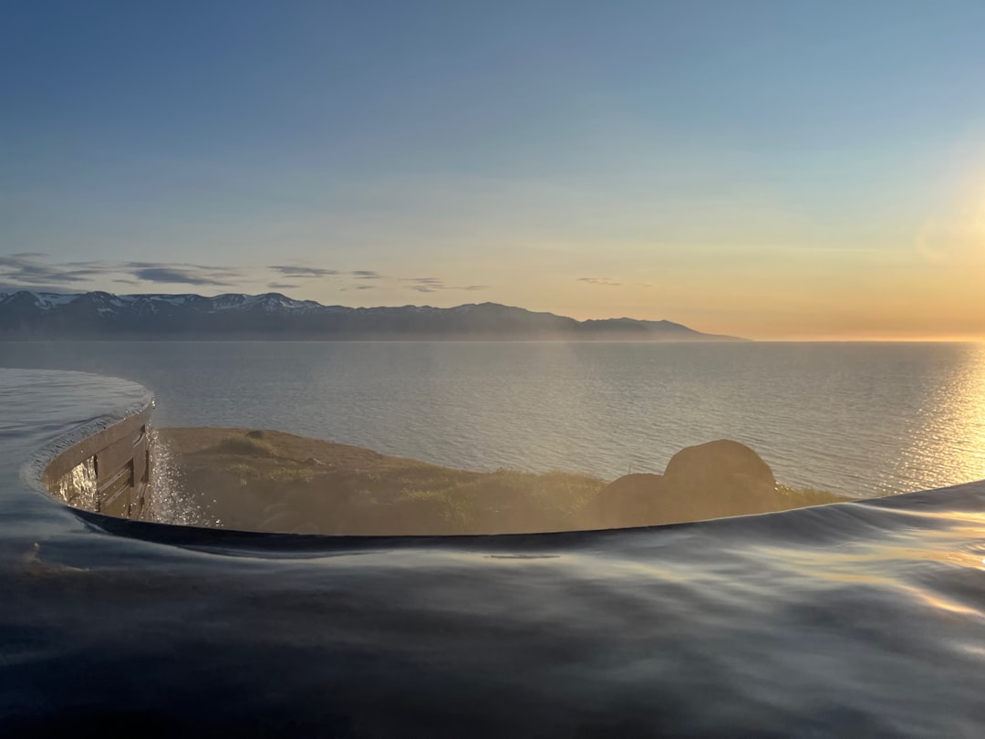 a boat floating on top of a large body of water,