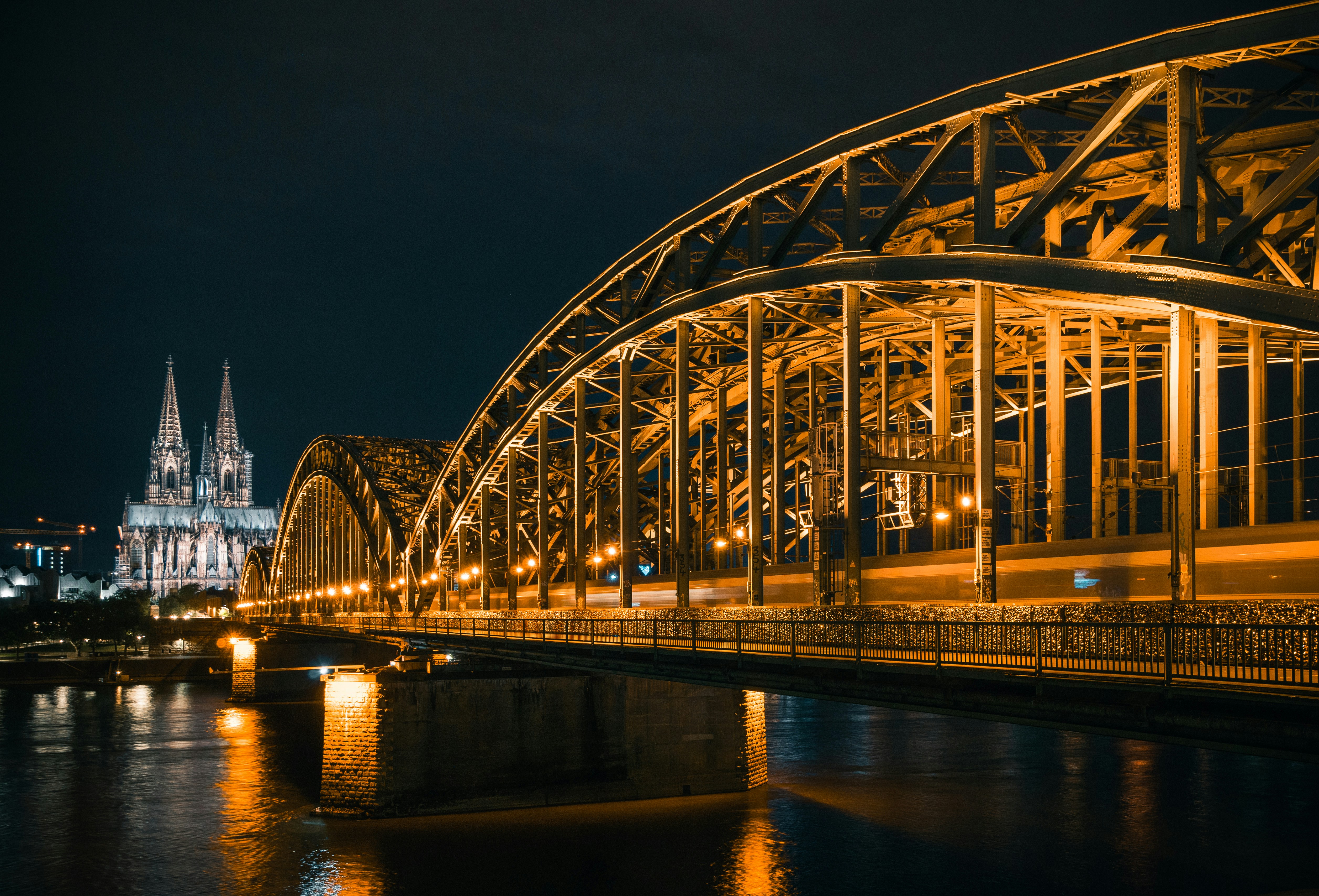 a bridge over a body of water at night