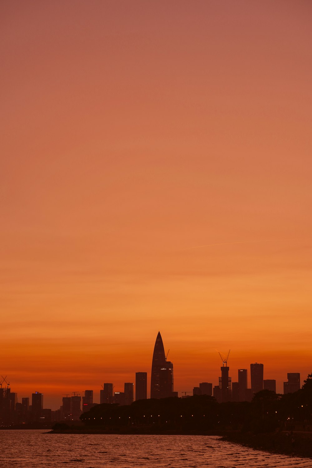 a view of a city skyline at sunset