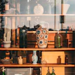 Small desktop ceramic ornaments with unique textures, arranged on a rustic shelf