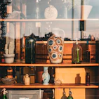 Small desktop ceramic ornaments with unique textures, arranged on a rustic shelf
