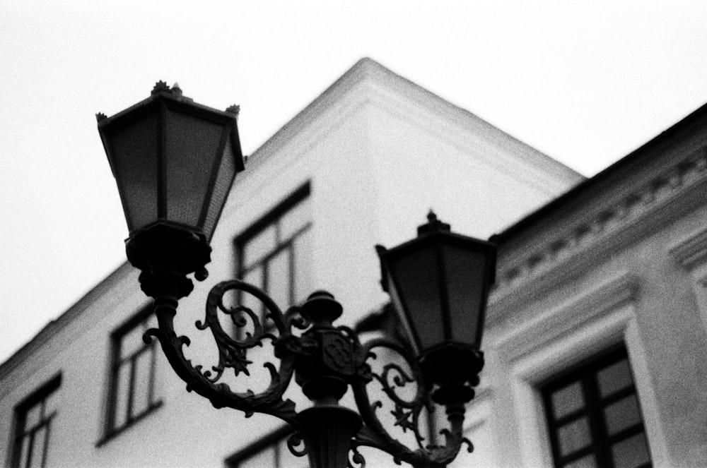 a black and white photo of a street light