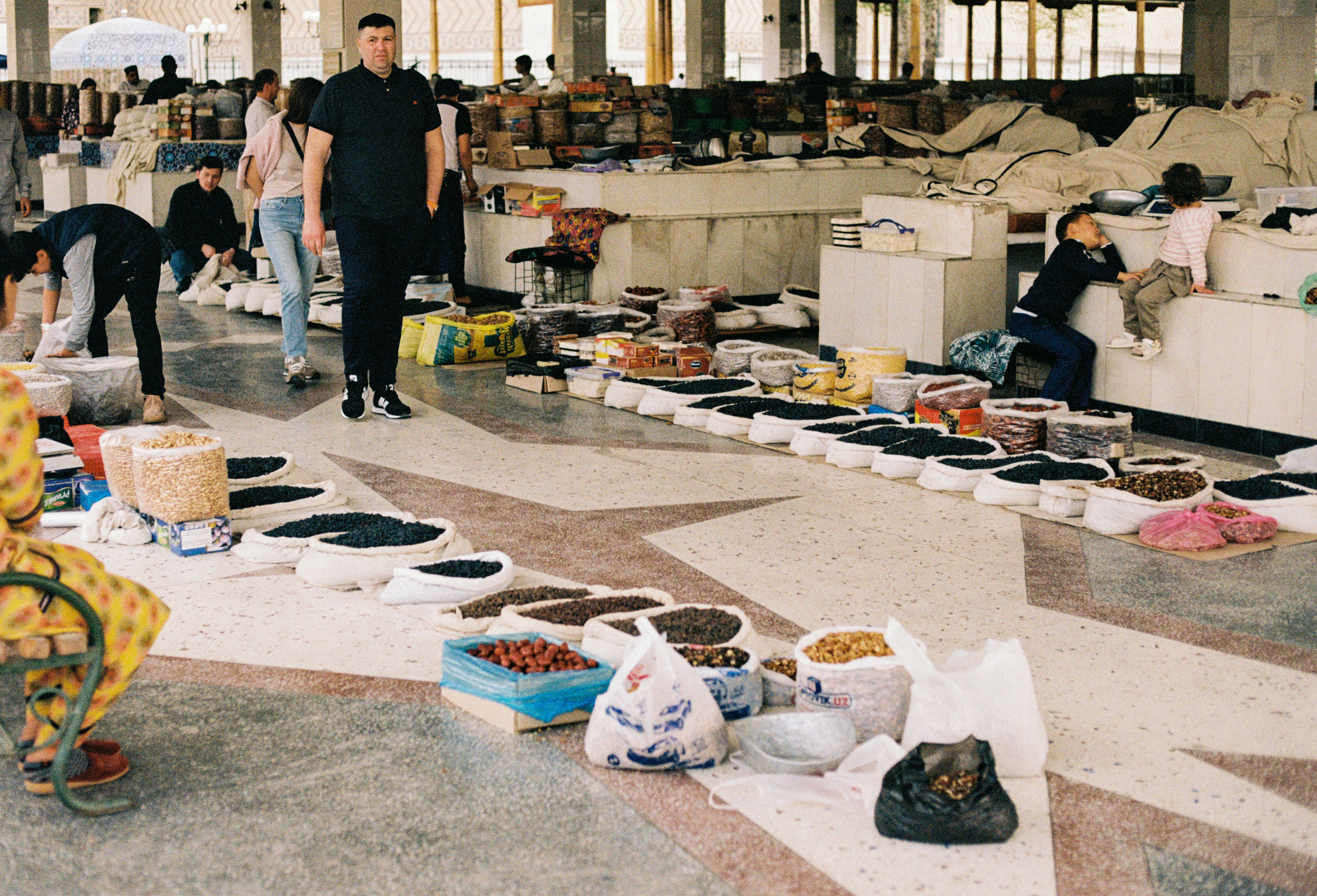 A dynamic shot of a modern factory floor in Uzbekistan, showcasing advanced machinery and local workers, representing industrial growth.