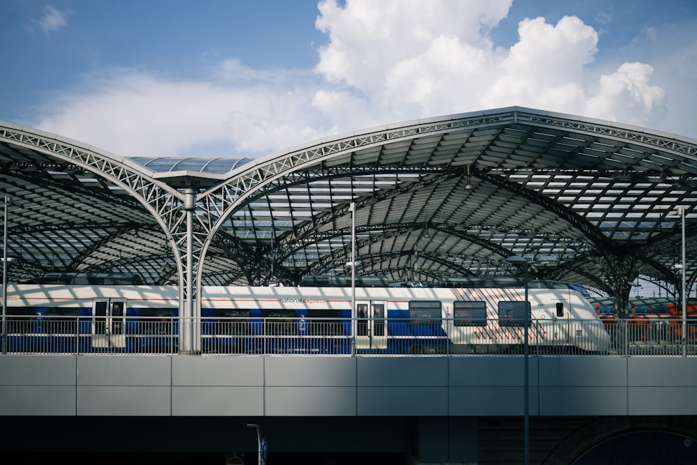 a train station with a train on the tracks