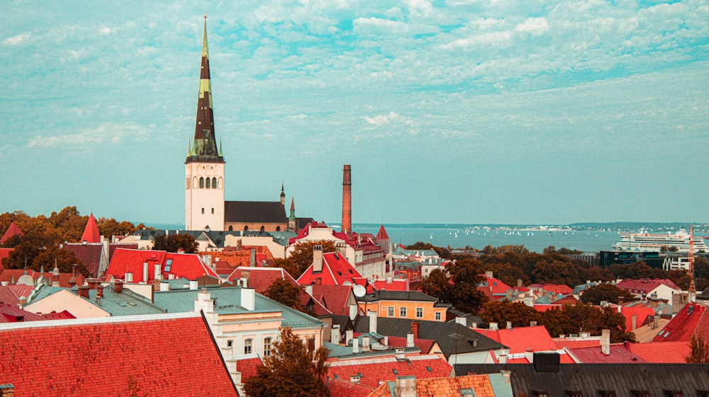 a view of a city with a steeple in the background