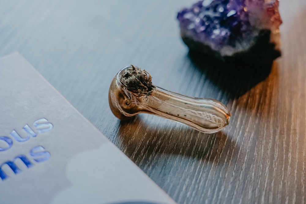 a ring sitting on top of a table next to a book