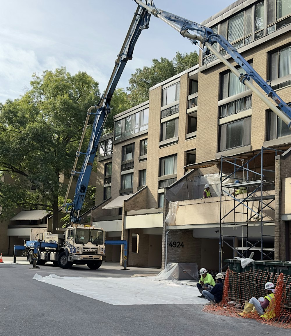 a large crane is being used to repair a building