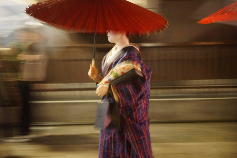 Graceful Tokyo woman in kimono with umbrella