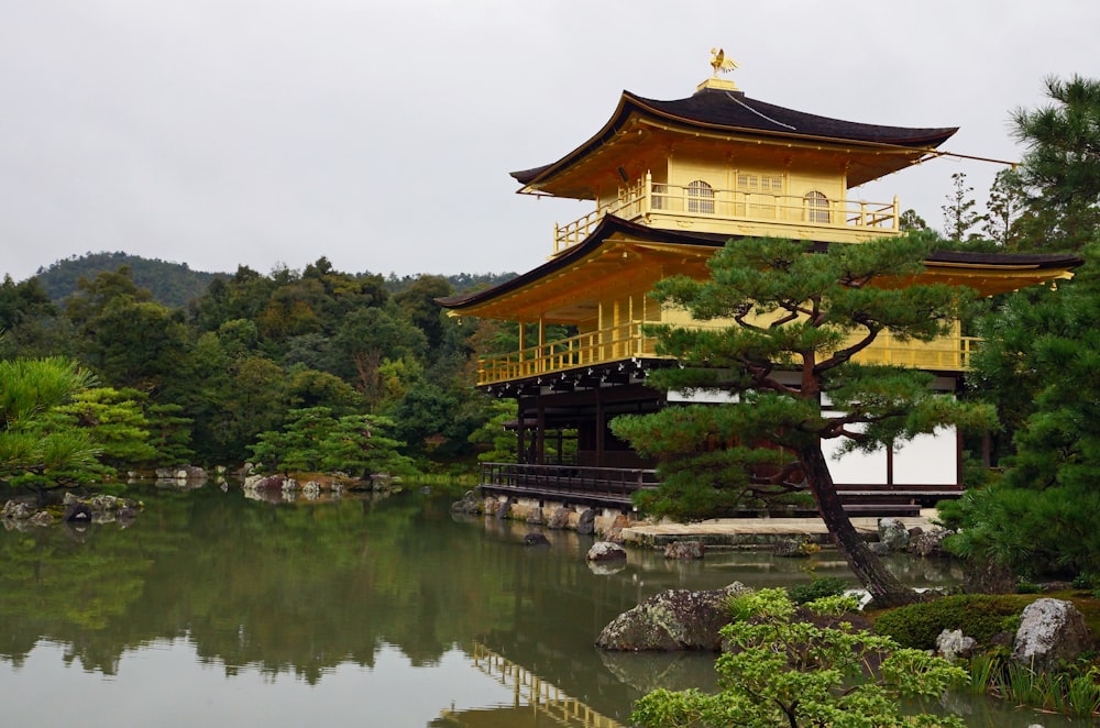 a large yellow building sitting next to a body of water