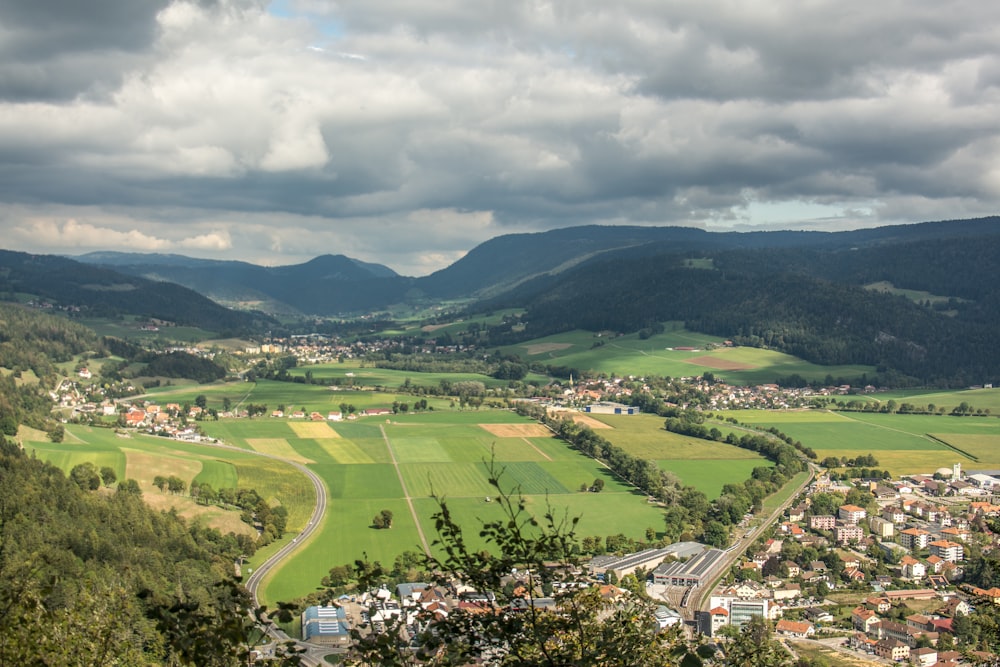 a scenic view of a town in the middle of a valley