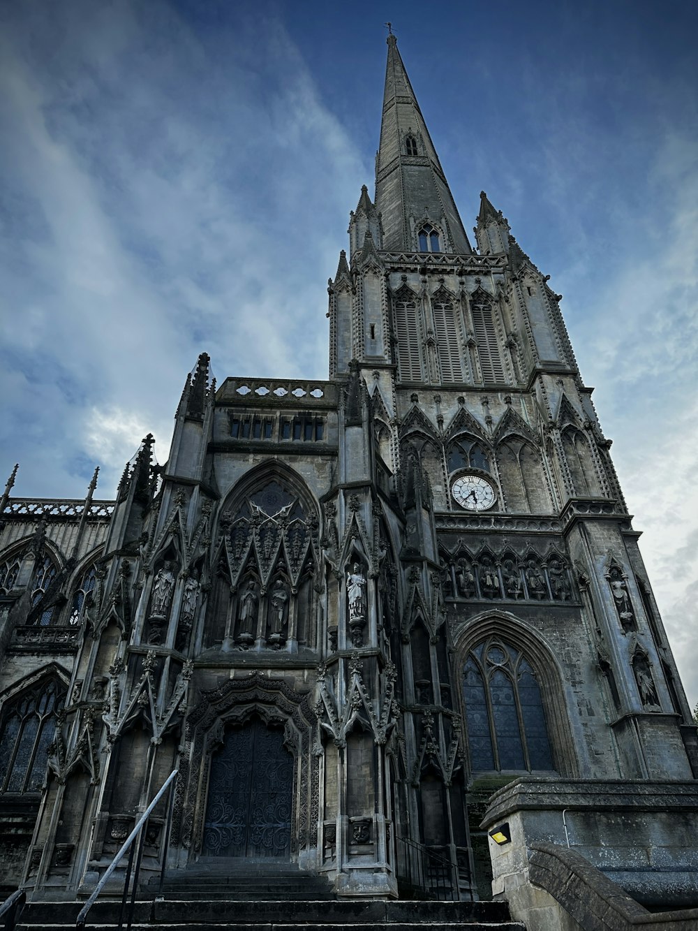 a large cathedral with a clock on the front of it