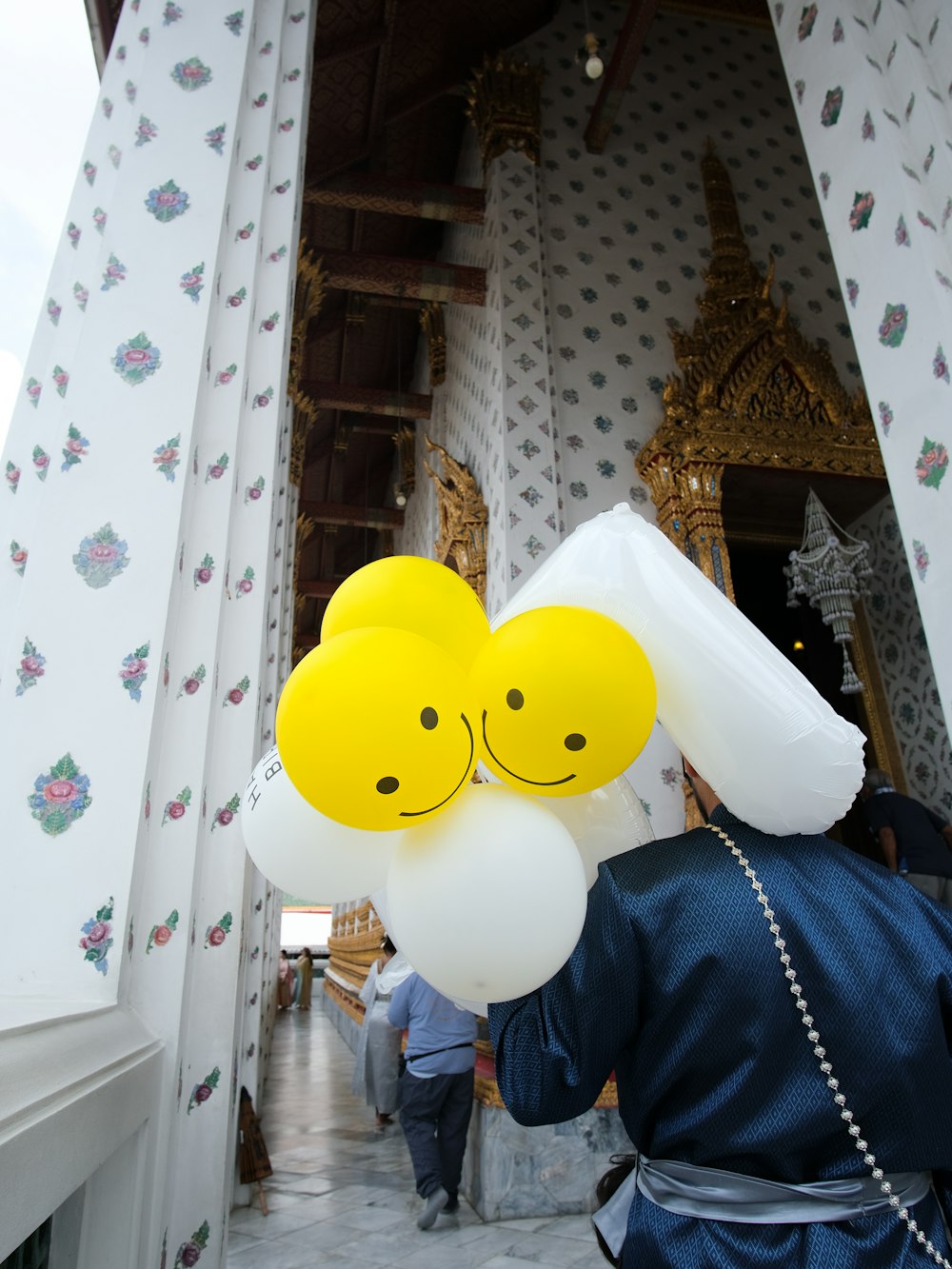 a couple of balloons that have faces on them