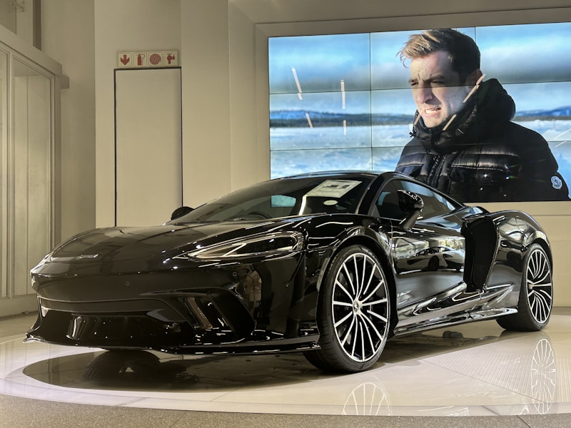 Black sports car indoors