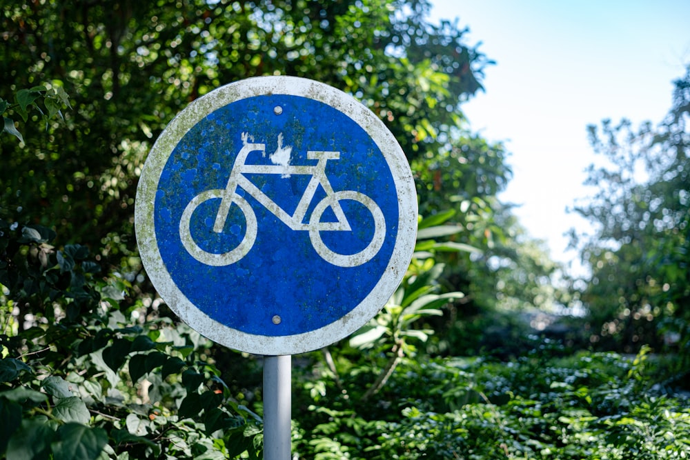 a blue sign with a bicycle on it