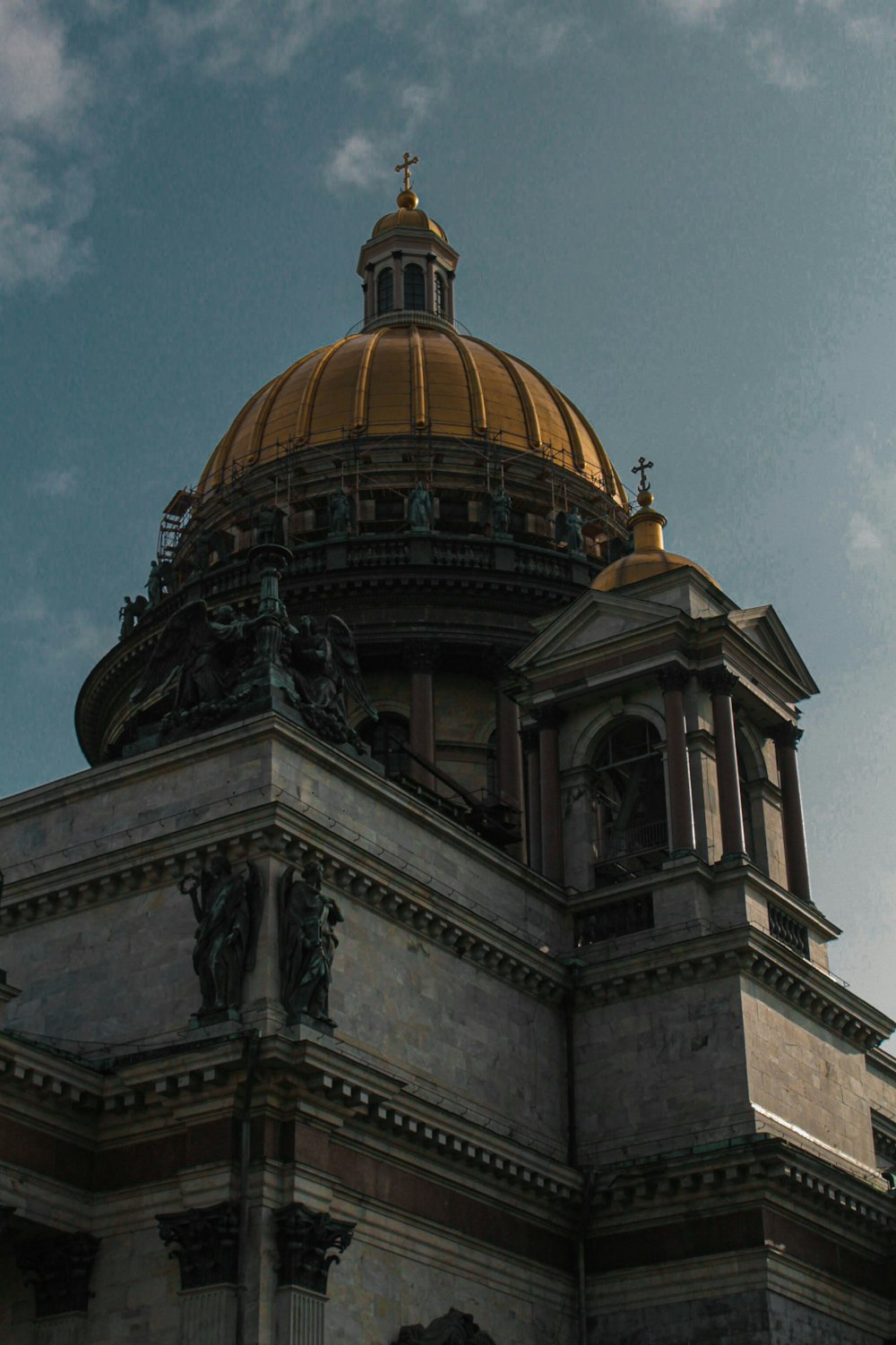 a large building with a gold dome on top