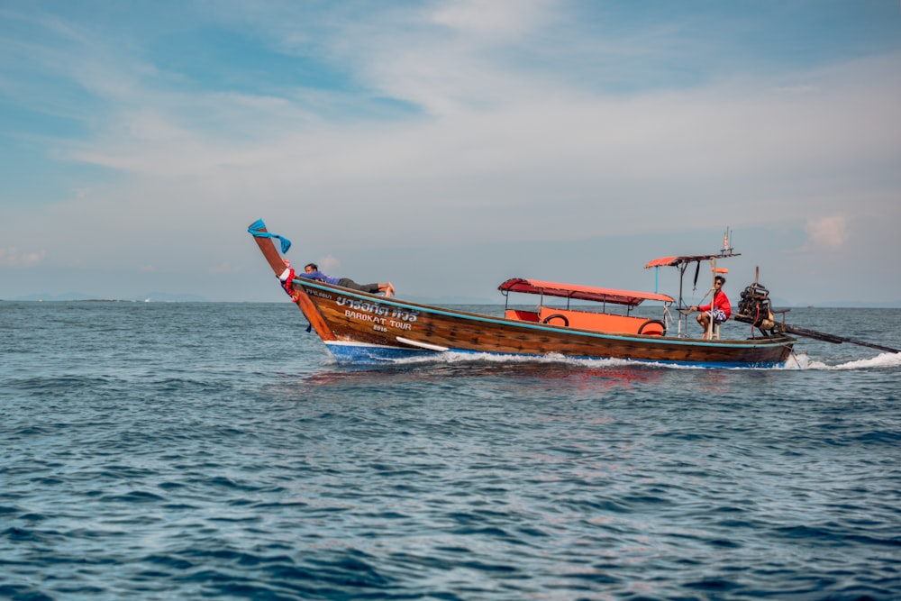 a boat with people on it in the water