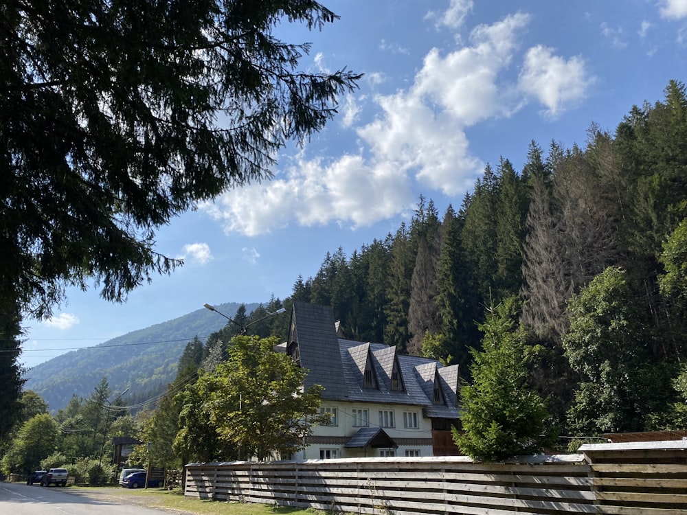 a large house sitting on the side of a road