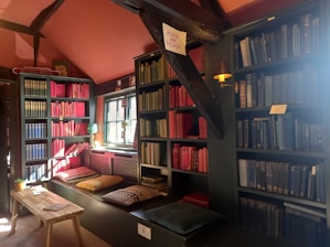A vibrant, colorful space filled with books, journals, and a cozy corner for prayer and reflection.