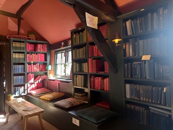 A vibrant, colorful space filled with books, journals, and a cozy corner for prayer and reflection.
