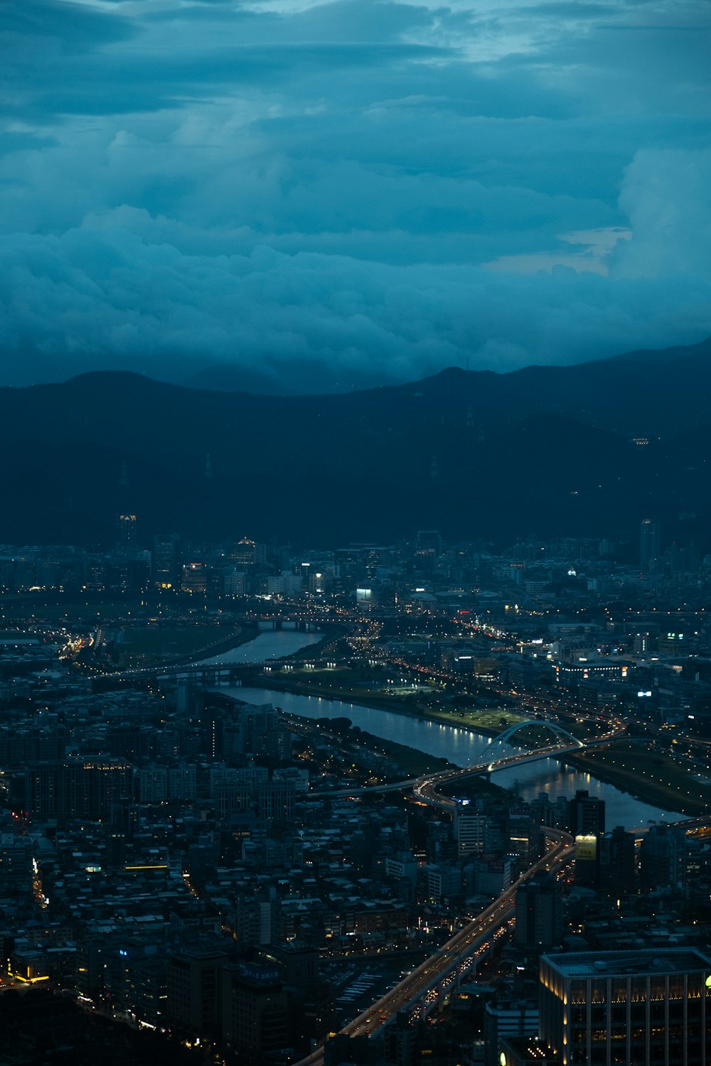 a view of a city at night from the top of a building