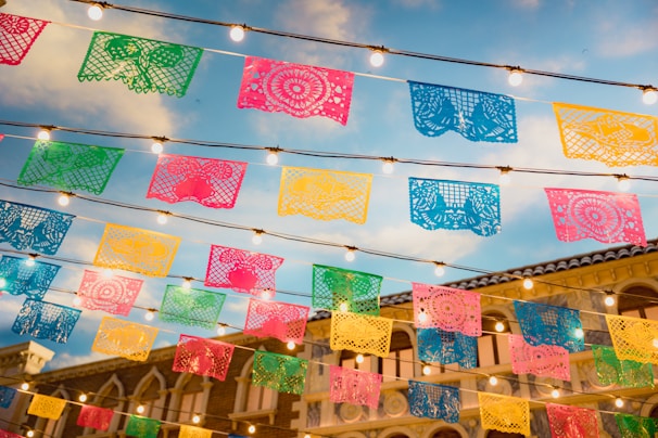 A beautifully designed banner displayed at an event, representing Grupo Memos.