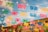 Colorful papel picado banners are strung across the scene, illuminated by hanging string lights against a background of blue sky and a building with classical architecture.