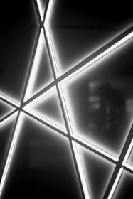 Abstract digital matrix with sharp, glowing lines converging like precision shots.