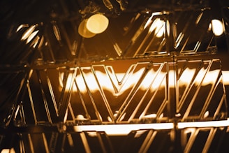 A close-up of a handcrafted Moroccan copper tray with intricate geometric patterns reflecting warm light.