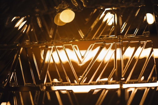 A close-up of a handcrafted Moroccan copper tray with intricate geometric patterns reflecting warm light.