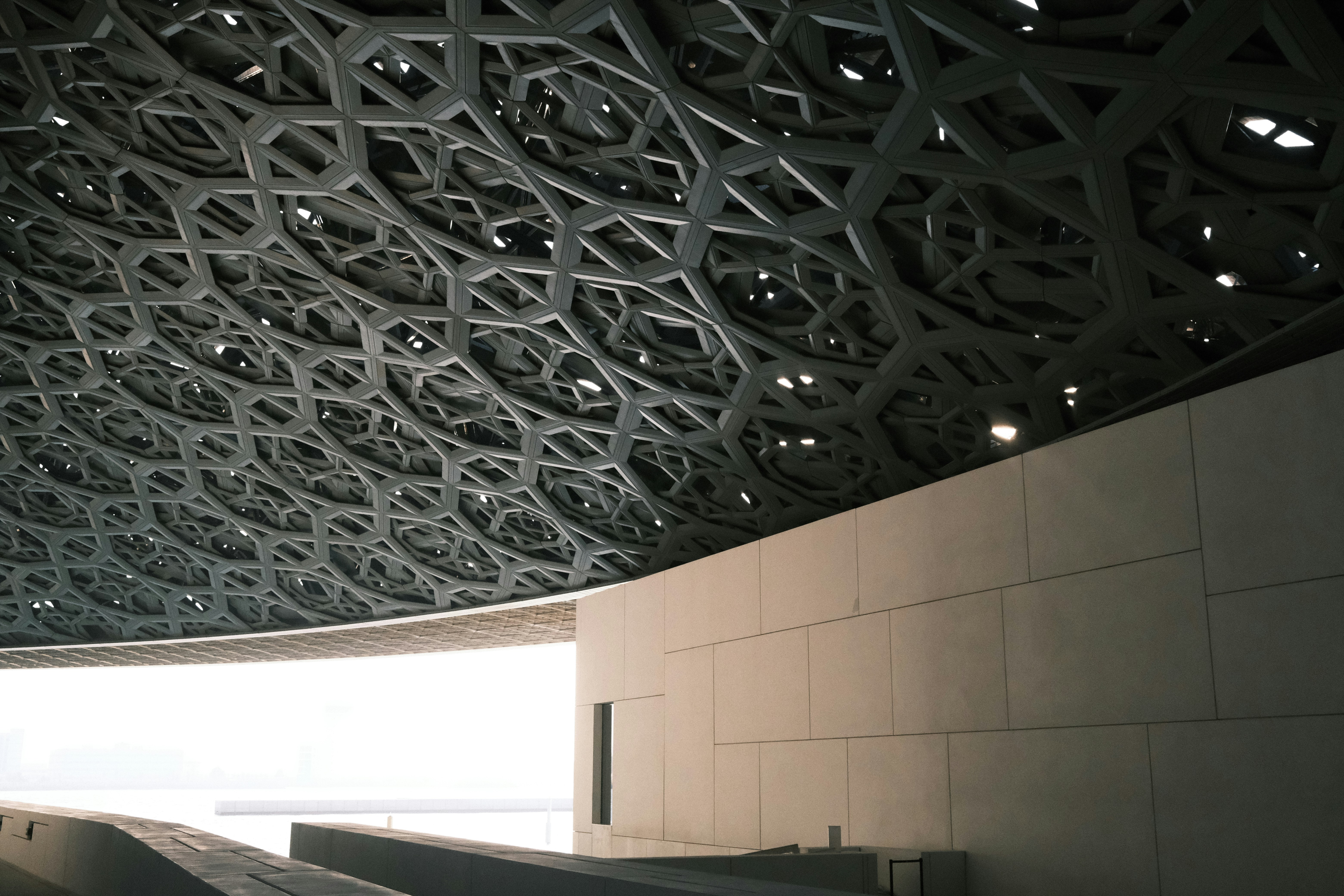 the ceiling of a building has intricate designs on it