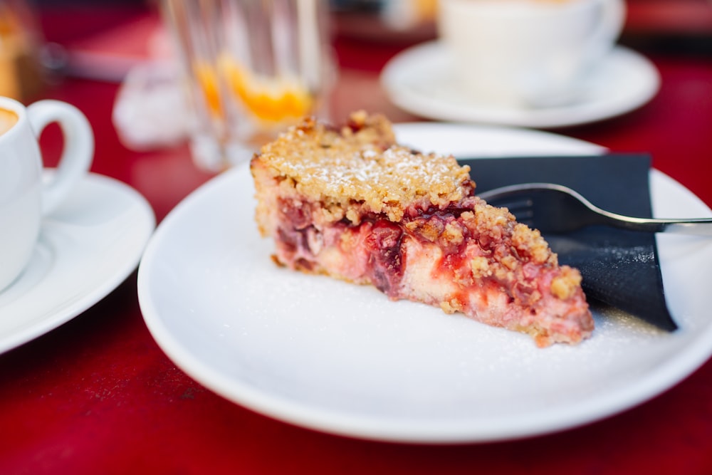 a piece of pie sitting on top of a white plate