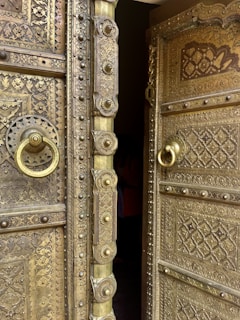 a close up of a metal door with a handle