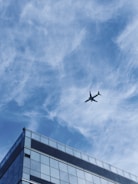 Aerial view of a completed commercial building with glass facade.