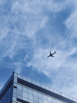 Aerial view of a completed commercial building with glass facade.