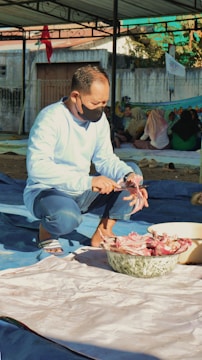Instructor demonstrating halal food handling techniques to participants.