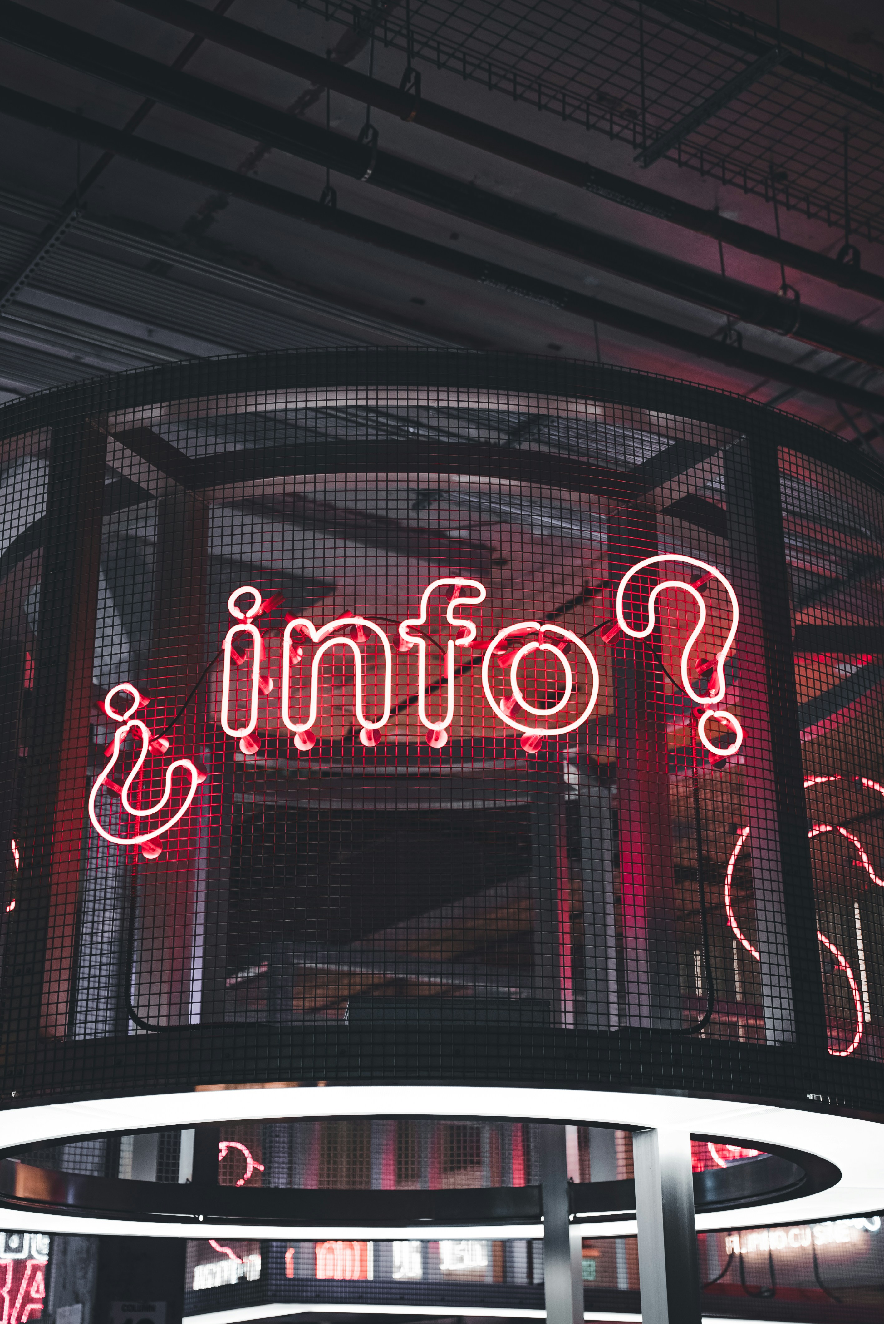 a neon sign that says ponni's on a building