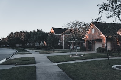 A suburban street lined with beautiful houses.