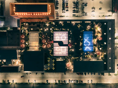 Evening view of a residential complex with soft lighting highlighting geometric shapes.
