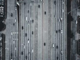 A drone shot of a busy highway filled with cars.