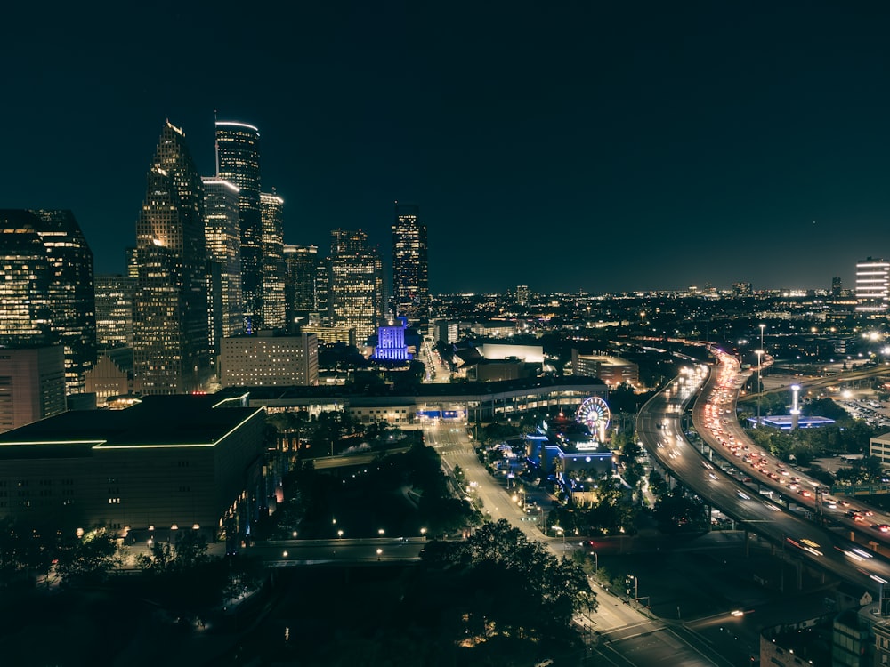 a night view of a city with lots of tall buildings