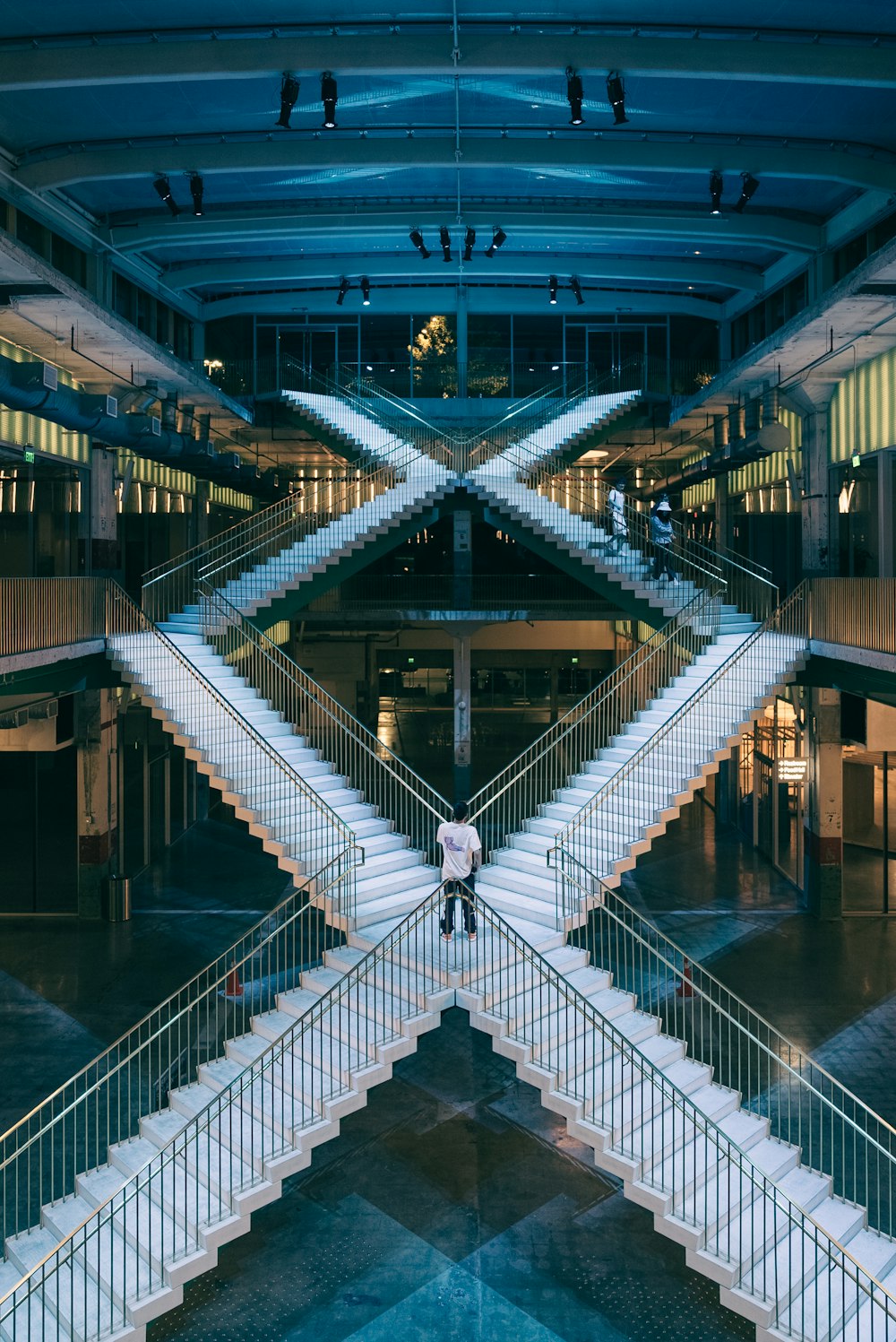 a person standing on a set of stairs in a building