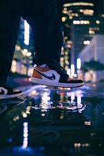 Person walking comfortably in stylish sneakers on a city street.