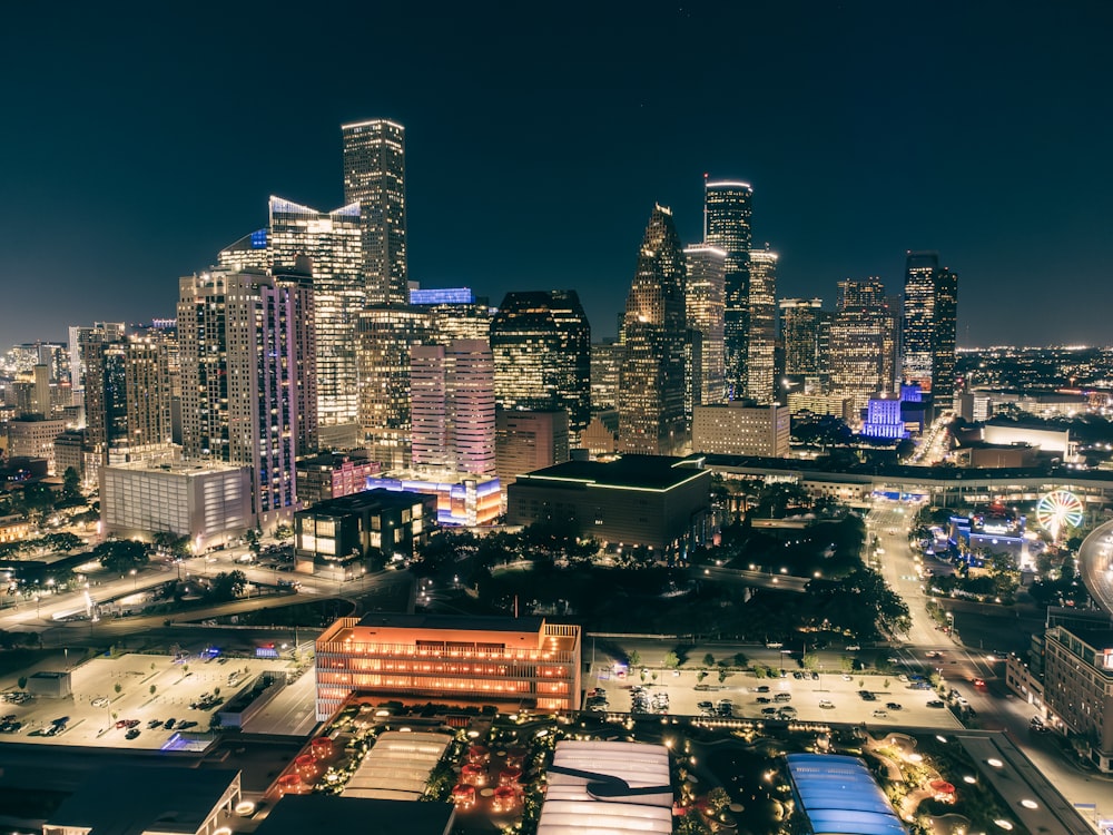 a city at night with a lot of tall buildings