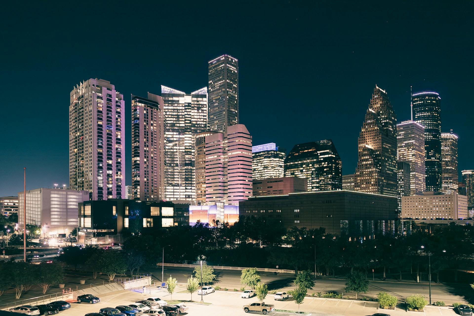 a city at night with a lot of tall buildings