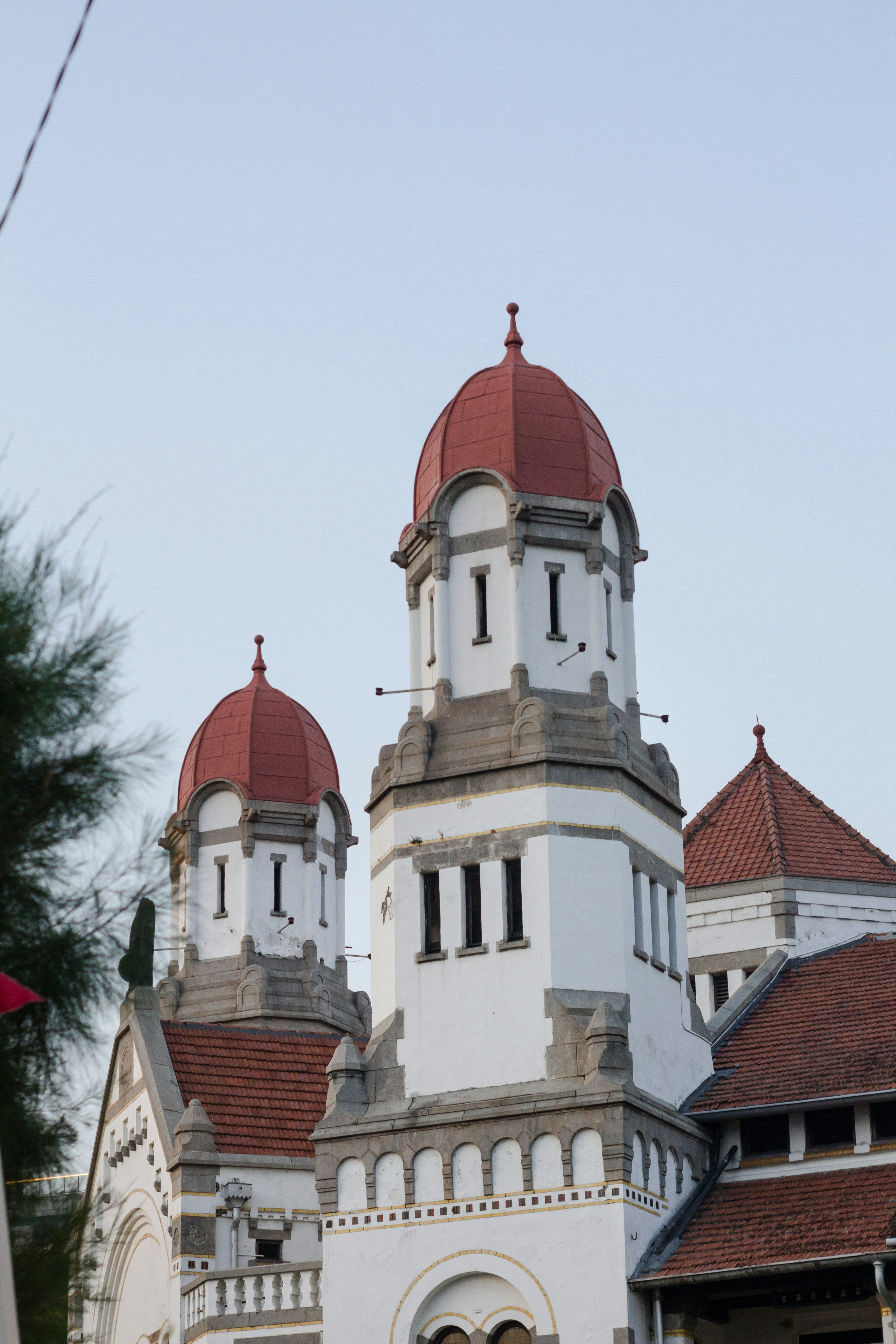 a large white building with a red roof